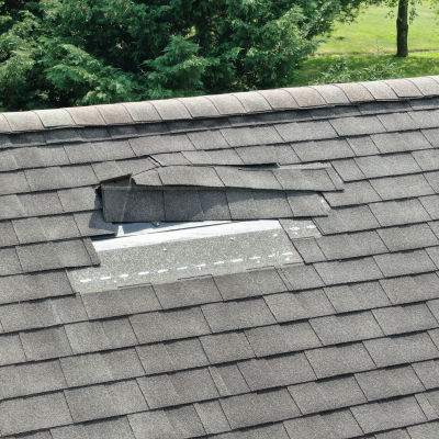 Roof damaged by fallen tree branch in Livingston, NJ